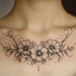 Ein florales Fine Line Blumentattoo für Frauen